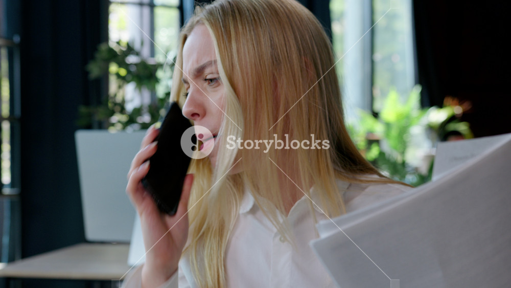 Irritated Caucasian business woman stress talking phone with documents fail bad work job businesswoman female girl talk smartphone