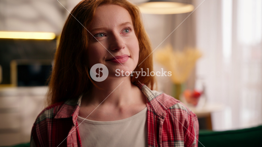 Portrait smiling calm peaceful dreamy Caucasian woman female girl dreaming thinking satisfied carefree relaxing indoors looking for idea
