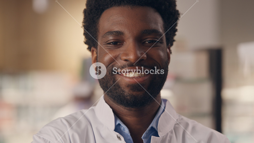 African American man doctor ethnic male close up portrait healthcare consultant pharmacist therapist physician practitioner smiling pharmacy