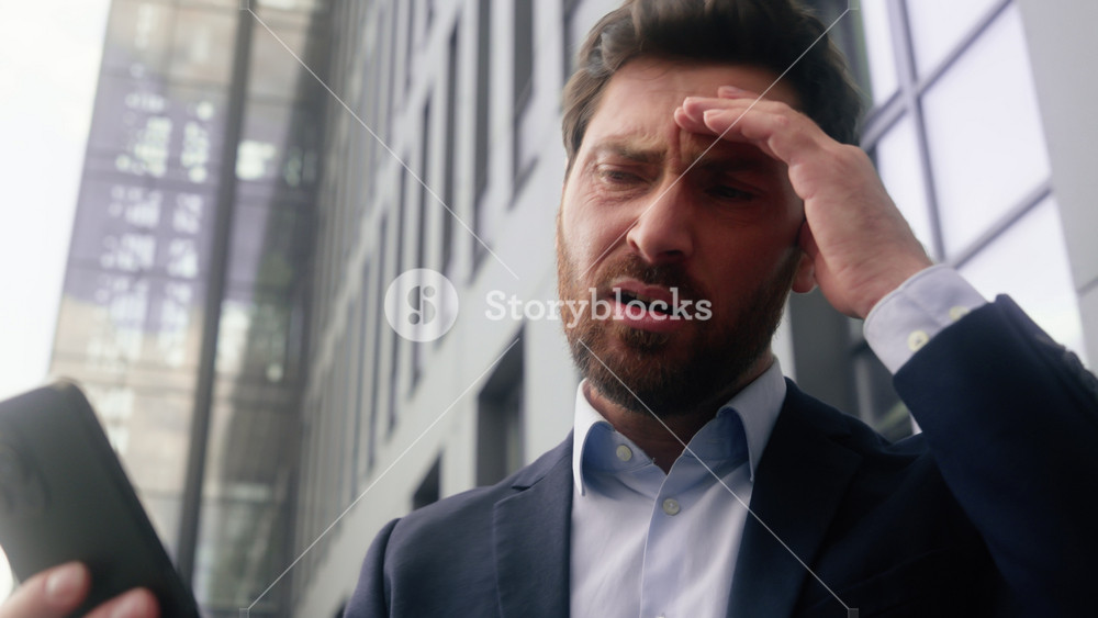 Emotional upset sad stressed disappointed Caucasian middle aged adult man male guy business employer businessman manager entrepreneur