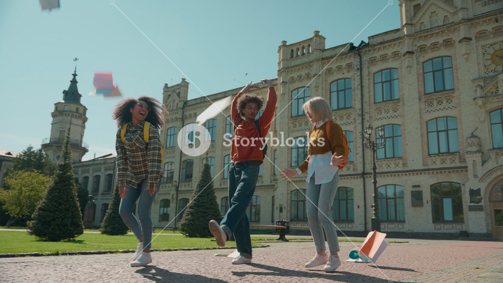 Three multiracial students girls African American women Caucasian female ladies boy man guy male leave college university high school