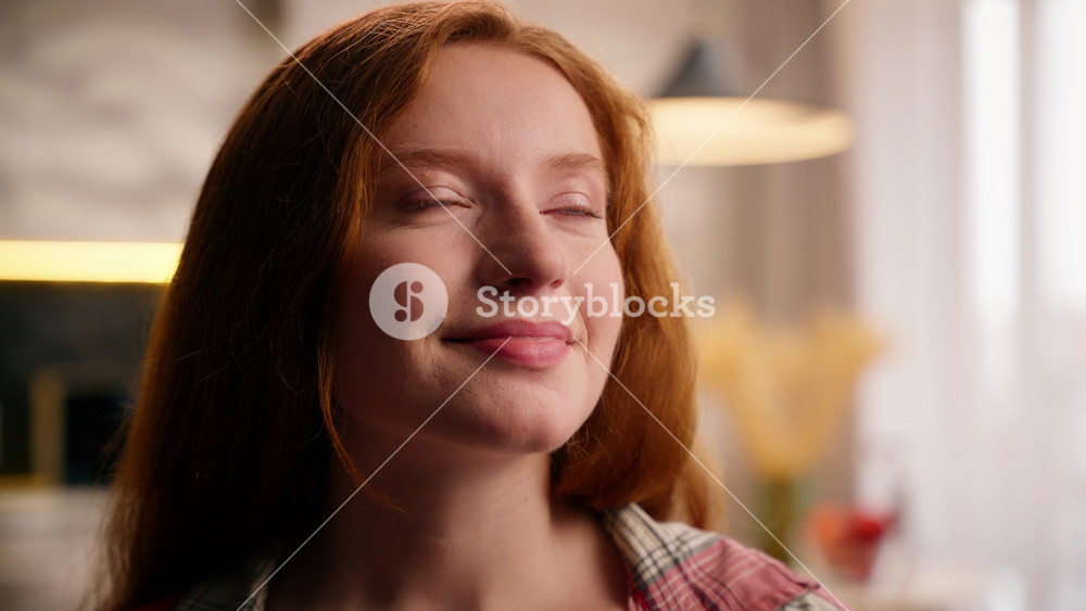 Young Caucasian woman teen girl dreaming happy positive dream contemplating calm looking away pondering solution decide at home indoors