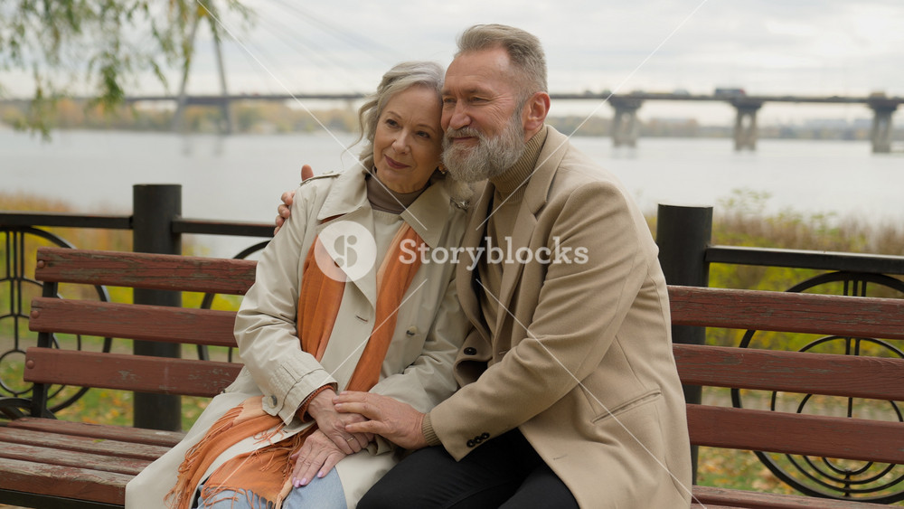 Caucasian old people male female happy woman man affectionate bonding cuddling married couple in love wife husband cuddle hug in park rest