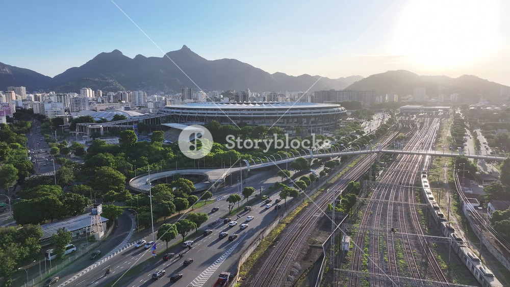 Maracana Stadium In Rio De Janeiro Brazil. Modern Football Stadium Overlooking A Dense Downtown City. Sunset Sky Downtown Cityscape. Sunset Outside Panning Wide. Rio de Janeiro Brazil.