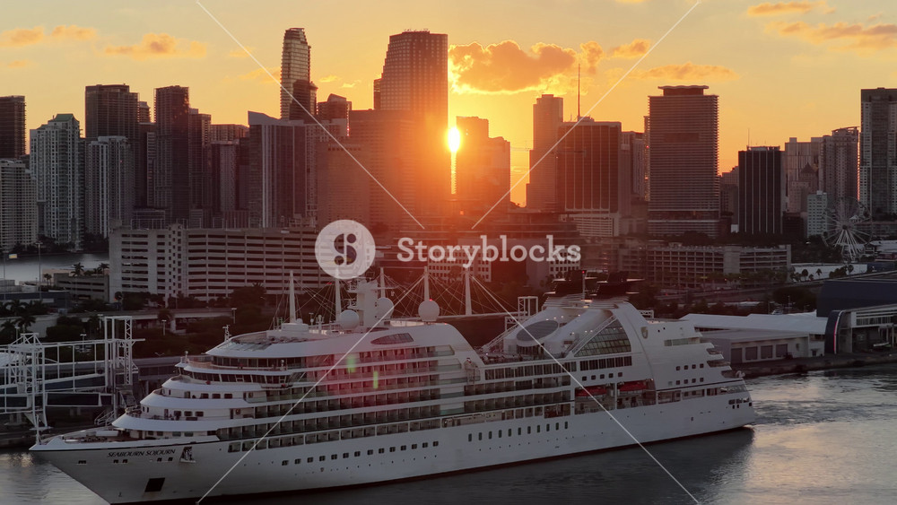 Miami, Florida, United States - 8.13.2026 - Port Of Miami At Miami In Florida United States. Aerial View Of A Large Red Cargo Ship Moored Near The Port. Sunrise Cities Of The World. Landmark Cityscape.