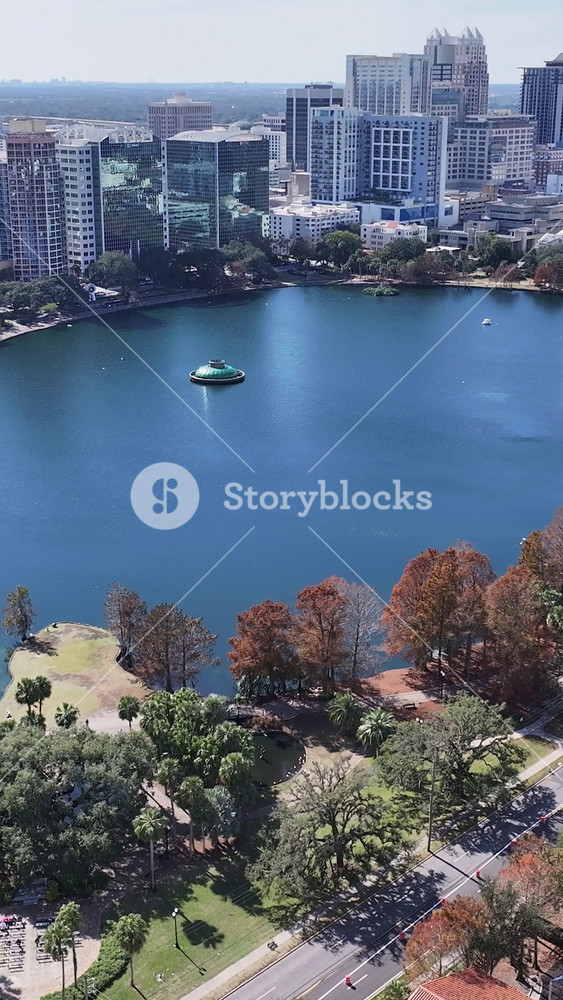 Orlando, Florida, United States - 1.5.2026 - Eola Park At Orlando In Florida United States. Sunny Day. Aerial View Of A High-Rise Buildings And Traffic Showcasing Urban Life.