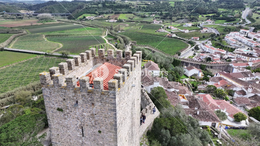 Obidos Castle At Obidos In District Of Leiria Portugal. Historic City Scenery. Medieval Architecture. Walls Of Castle Construction. Obidos Castle At District Of Leiria Portugal. Old Village.