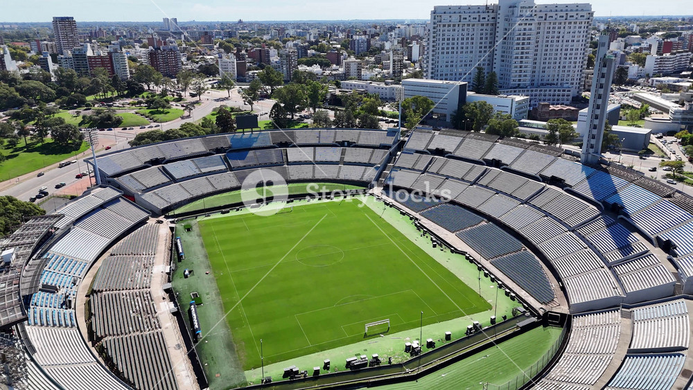 Montevideo, Maldonado, Uruguay - 7.4.2026 - Centenario Stadium At Montevideo In Maldonado Uruguay. Modern Football Stadium Overlooking A Dense Downtown City. District Skyline. Cities Of The World Landscape.