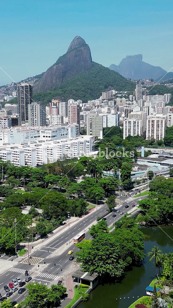 Rodrigo De Freitas Lake In Downtown City Rio De Janeiro Brazil. Birds Eye View Of Stunning Dark River And Forest Trees. Town Clouds Sky Backgrounds Urban. Town Outdoors Downtown Panorama.