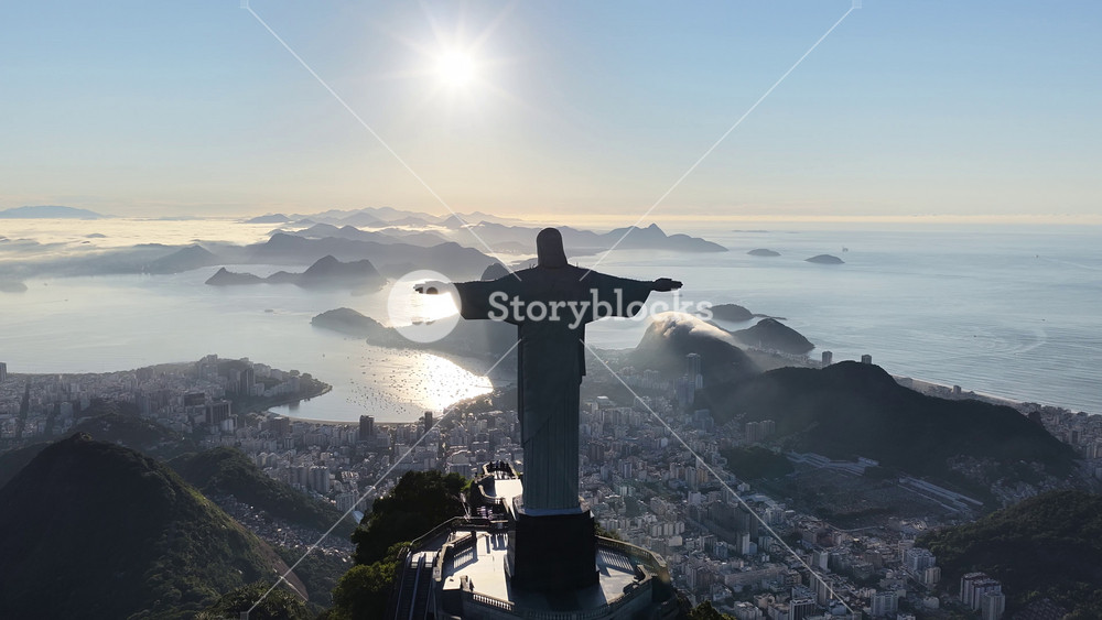 Sunrise Christ The Redeemer In Rio De Janeiro In Brazil. Sunrise Skyline. Sugarloaf Mountain. Christ The Redeemer Statue Landscape. Sunrise Skyline In Christ The Redeemer In Rio De Janeiro In Brazil.