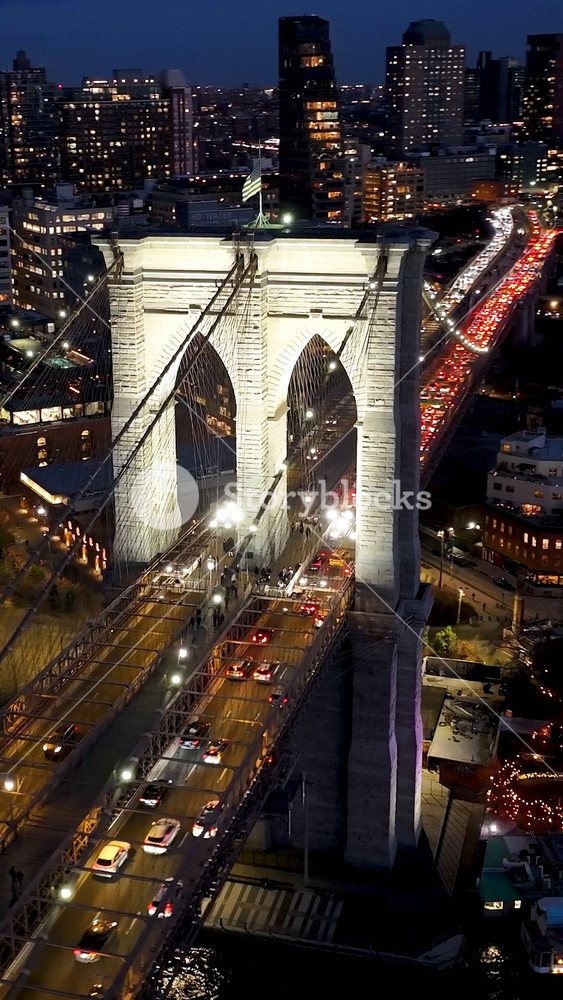 Night Scape Of Brooklyn Bridge At Manhattan In New York United States. City At Night Scene. Illuminated Bridge Landscape. Brooklyn Bridge At New York United States. Highrise Buildings.