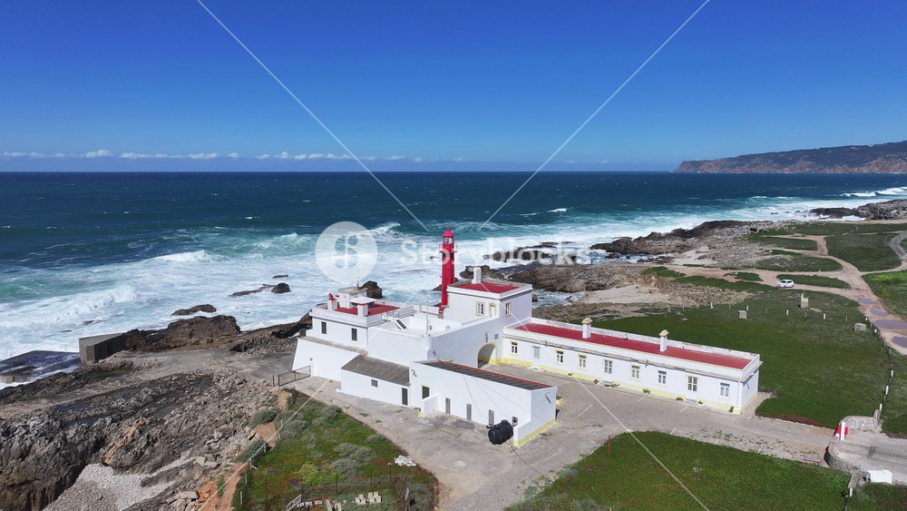 Shallow Cape Lighthouse At Cascais In District Of Lisbon Portugal. Beach Skyline. Lighthouse Landscape. Summer Travel. Shallow Cape Lighthouse At Cascais In District Of Lisbon Portugal.