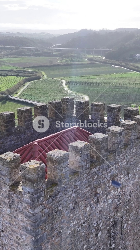 Obidos Castle In Obidos District Of Leiria Portugal. Aerial View Of Landmark Medieval Building In Downtown Scene. Business Sky Downtown Cityscape. Business Downtown Panning Wide.