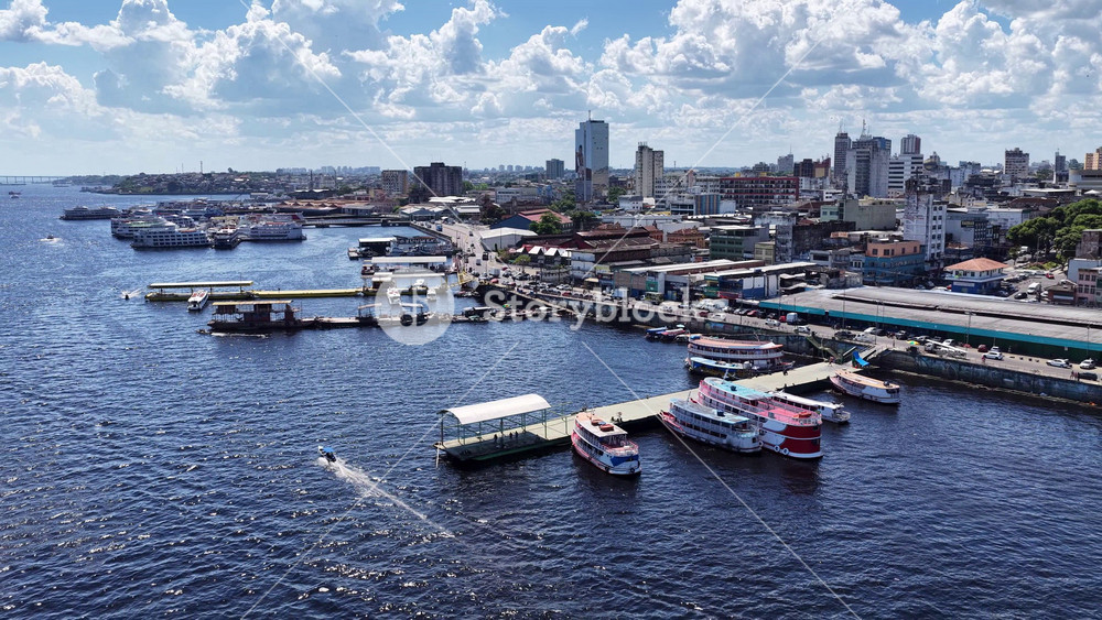 Manaus Harbor In Manaus Amazonas Brazil. Aerial View Of A River Surrounded By Lush Green Tropical Rainforest. Downtown Cityscape. Cities Of The World. Manaus Amazonas.