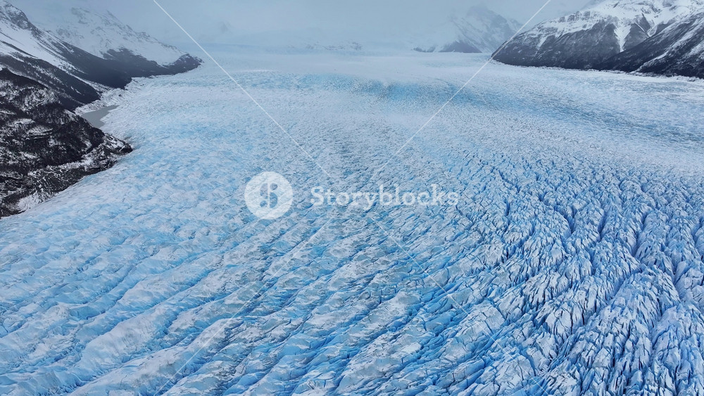 Perito Moreno Glacier In El Calafate Santa Cruz Argentina. Birds Eye View Of Famous Glacier In A Patagonia Landscape. Snow Fall Lake Iceland Blizzard. Snow Fall Lakeshore Nature.
