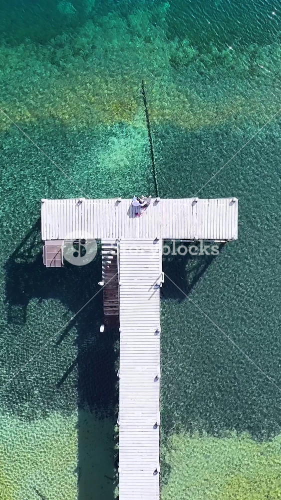 Harbor Pier In Villa La Angostura Neuquen Argentina. Aerial View Of Stunning Beach With Crystal Clear Waters. Nature Tourism Icon Snow Covered Forest Trees. Snow Covered Patagonia Above View.