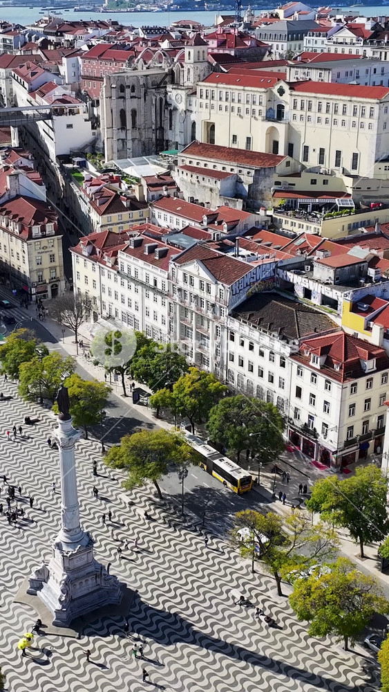 Dom Pedro Iv Square In Lisbon Portugal. Amazing Skysrapers And Traffic On Street Viewed From Above. Industry Landscape Buildings Amazing. Buildings. Lisbon Portugal.