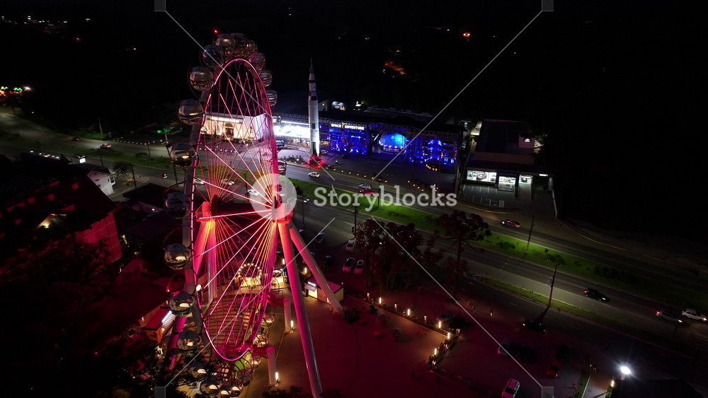 Canela, Rio Grande do Sul, Brazil - 5.26.2025 - Scenic Ferris Wheel At Canela In Rio Grande Do Sul Brazil. Aerial view of Ferris wheel dominating skyline of city.