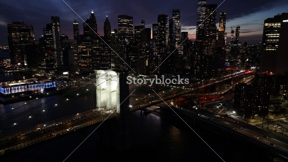 Night Scape Of Brooklyn Bridge At Manhattan In New York United States. City At Night Scene. Illuminated Bridge Landscape. Brooklyn Bridge At New York United States. Highrise Buildings.