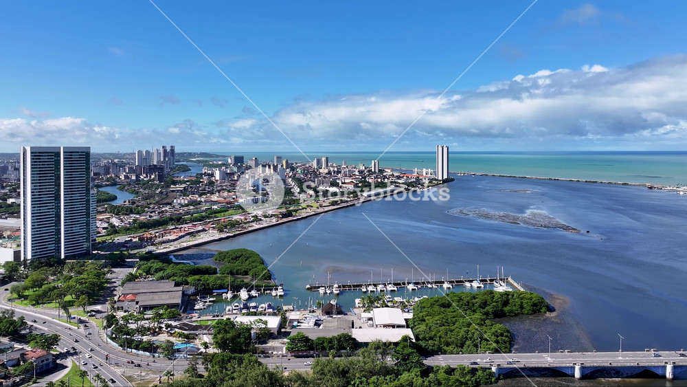 Riverfront Scene In Recife Pernambuco Brazil. Aerial View Of A Bustling City With High-Rise Buildings And Traffic. Construction Landscape Commercial Building Vibrant. Commercial Building.