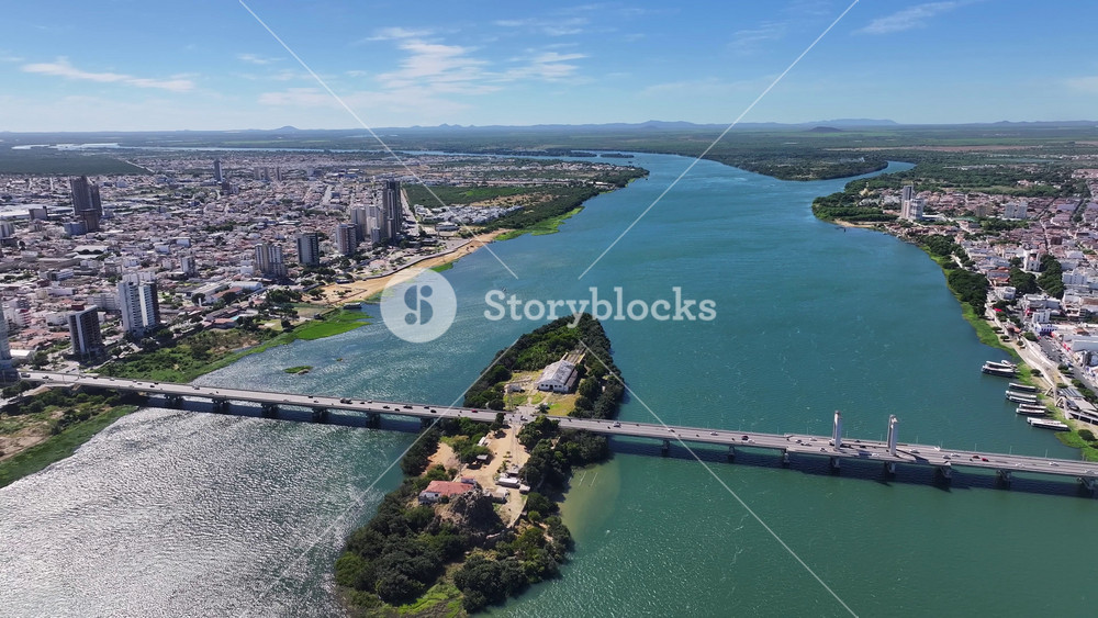 Dutra President Bridge In Petrolina Pernambuco Brazil. Aerial View Of A River Surrounded By Lush Green Tropical Rainforest. Cities Of The World Landscape. Landmark Town. Petrolina Pernambuco.