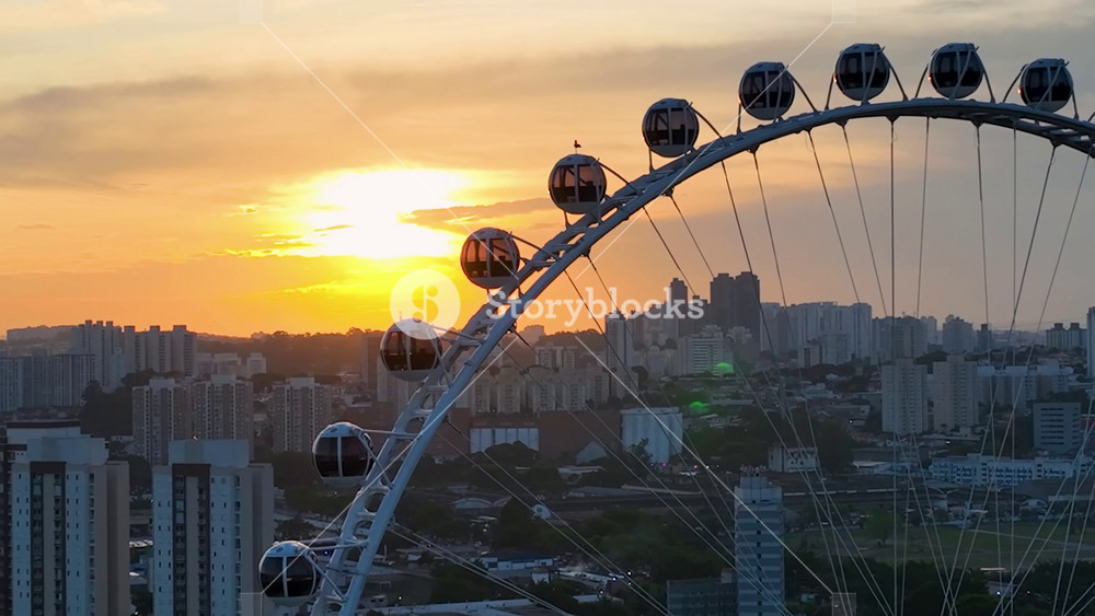 Sunset Ferris Wheel In Candido Portinari Park Sao Paulo Brazil. Tall Ferris Wheel In A Bustling Amusement Park In The City. Building Industry Skyline Birds View Beautiful.