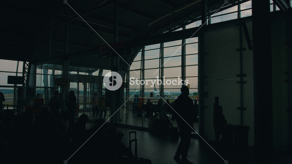 Poland, Warsaw - April 9, 2024: Warsaw Chopin International Airport. Waiting room with crowds of people waiting for their flights and view
