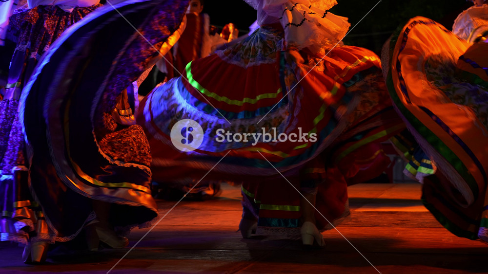 Women dancing with big flow dresses a Mexican cultural folk dance showing the different ethnic dances of La Paz, Baja California Sur, Mexico in slow motion.