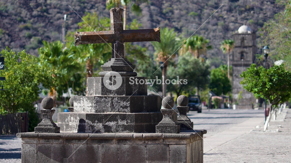 Witness the cross at the entrance to San Javier and the historic Mission near Loreto during sunrise in Baja California Sur