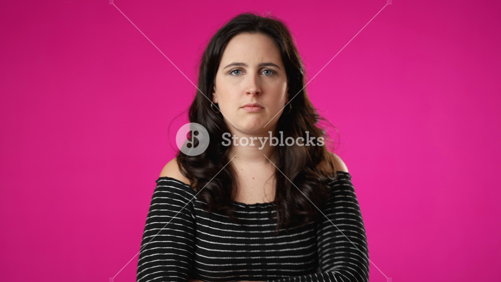 Portrait of angry frustrated despair upset portrait of young woman 20s isolated isolated on pink background with copy space
