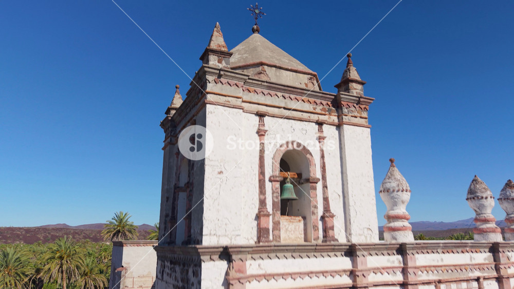 Aerial views showcase the Mission Church in San Ignacio, a historical landmark in Baja California surrounded by desert scenery