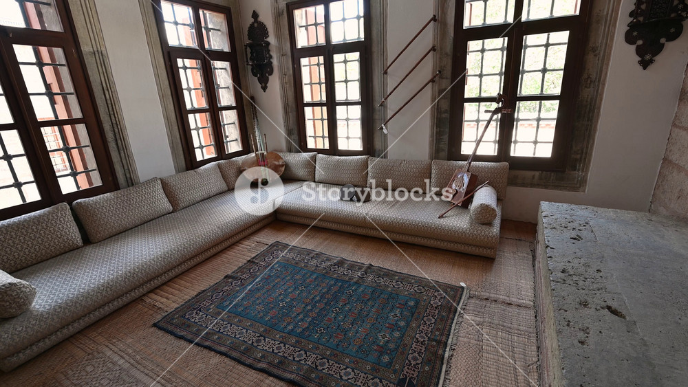 Istanbul, Turkey, August 1, 2025. One of the living rooms of Topkapi Palace with musical instruments. Intense natural light from the numerous windows. Travel destinations.