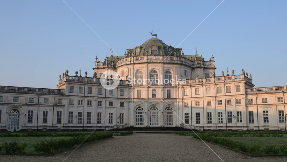 Stupinigi, turin, italy. March 23, 2026. Ornate facade of the palazzina di caccia of stupinigi, a rococo hunting lodge in piedmont, italy, slowly zooming in during sunset