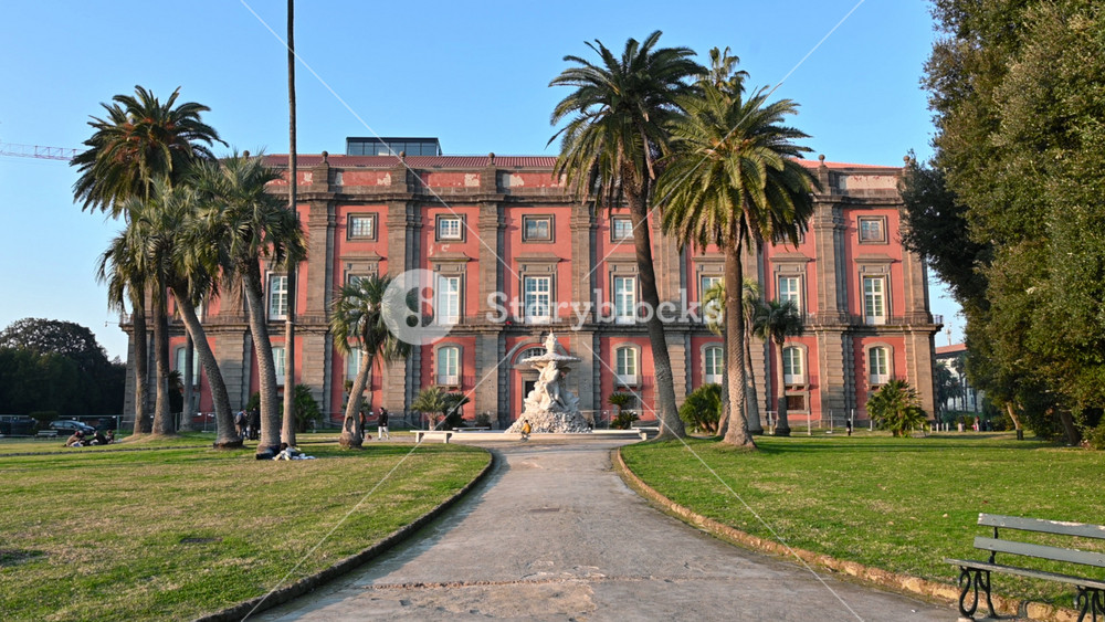 Naples, Italy, December 30, 2024. Front view of the palace's shorter facade with the gardens and the Belvedere Fountain. Beautiful sunny day. Travel destinations.