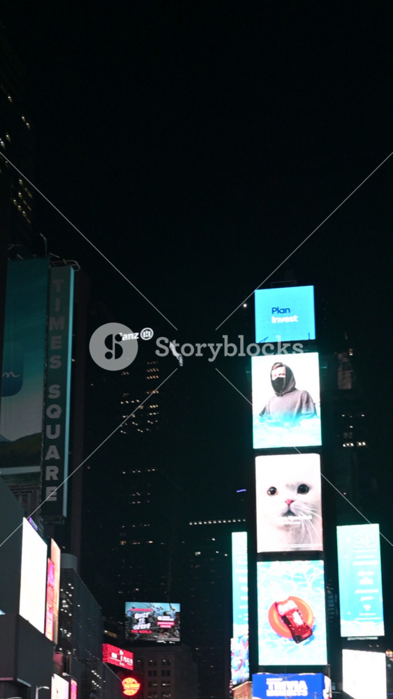New York City, USA, August 13, 2024. Fascinating vertical footage of Times Square, Manhattan. Crowded with people with its huge and very bright billboards, it is an iconic landmark of American tourism