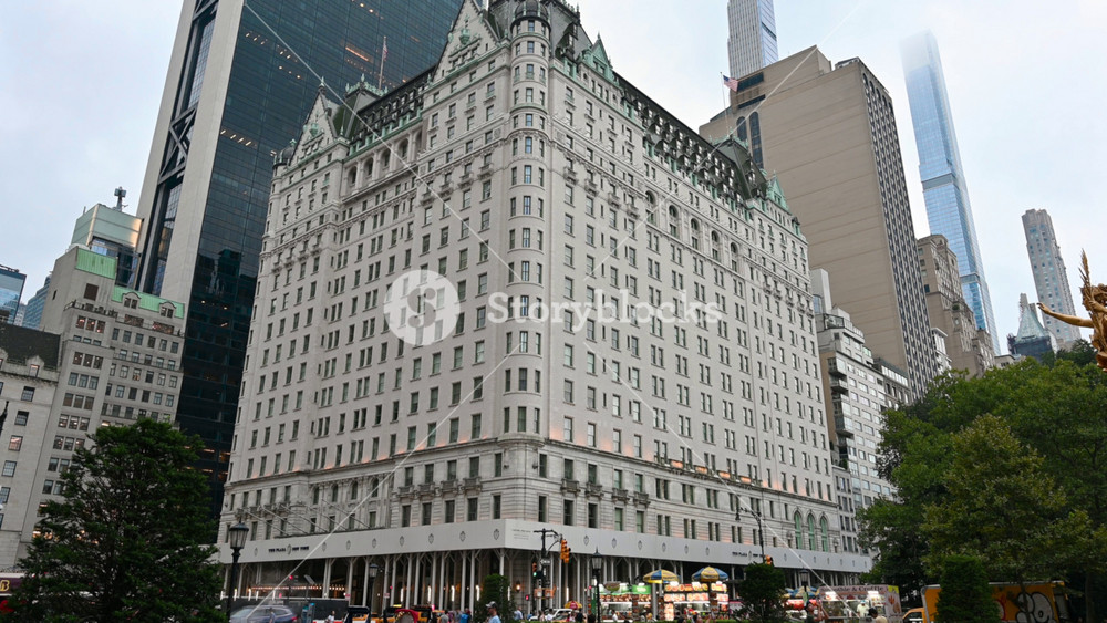 New York, USA, August 18, 2024. The imposing Plaza Hotel three-quarter view from Grand Army Plaza. People on the street, travel destinations.