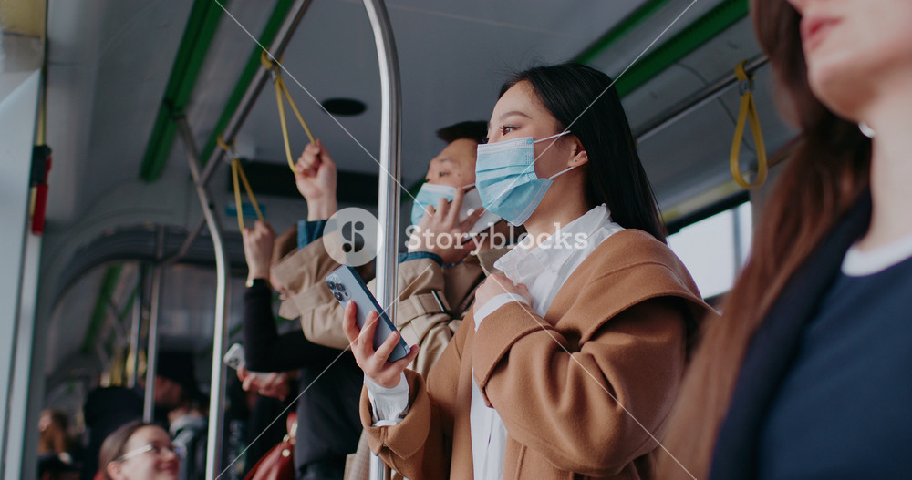 People traveling in city by train. Wearing masks for public safety. Facial masks. First step of disease prevention. Caring about others