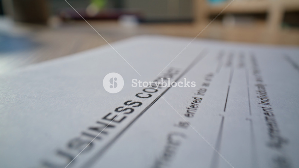 Lawyer hand stamping business deal on desk closeup. Unknown business person approving legal agreement at environment dolly shot.