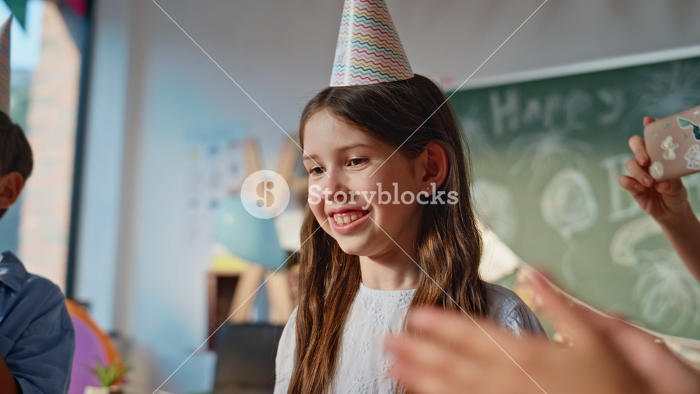 Happy schoolgirl enjoy congratulations at birthday party in decorated closeup. Smiling girl receiving gifts at celebration. Cheerful woman