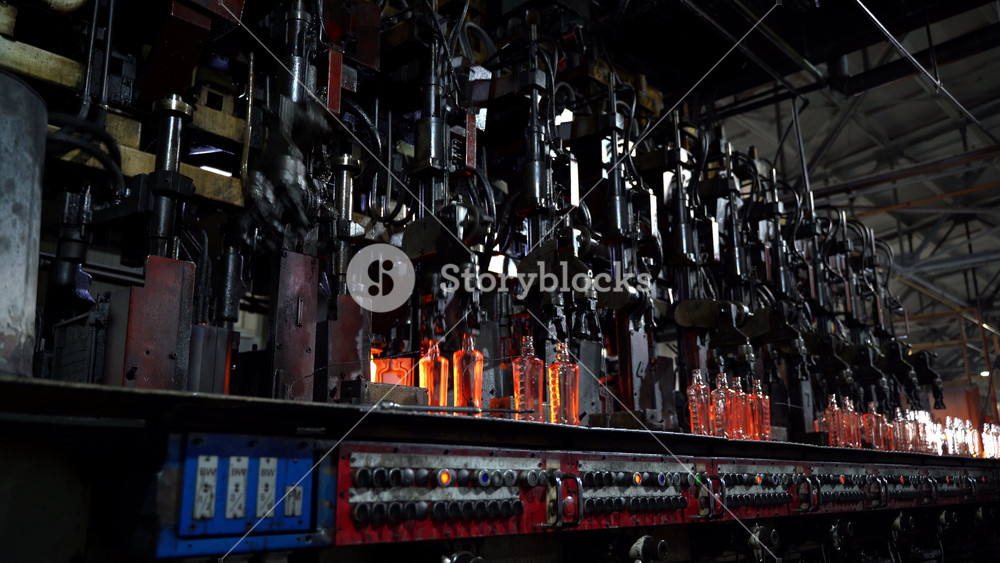 Manufacturing industrial factory with automated line for production of bottles with modern machinery equipment. bottle manufacturing plant
