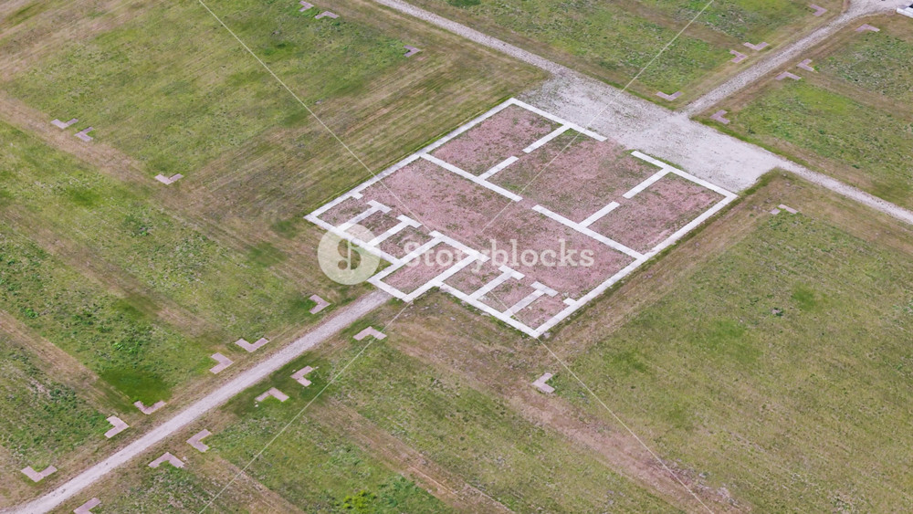 floor plan white concrete outlines reddish gravel infill roman fort castellum fectio utrecht netherlands top down aerial shot markers bunnik