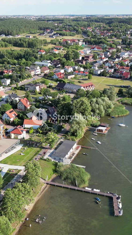 village charzykowy poland notera hotel lake harbor port marina high end luxury resort spa holiday travel destination forward aerial circling district sunshine landscape drone