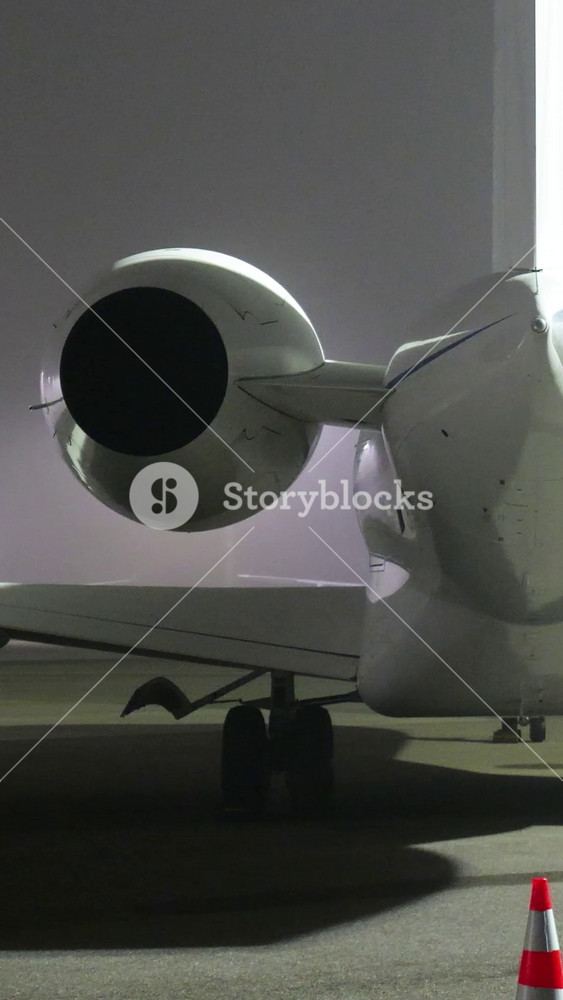 business jet parked apron night foggy conditions scene luxury wealth associated millionaire lifestyle tail view parking zurich airport switzerland