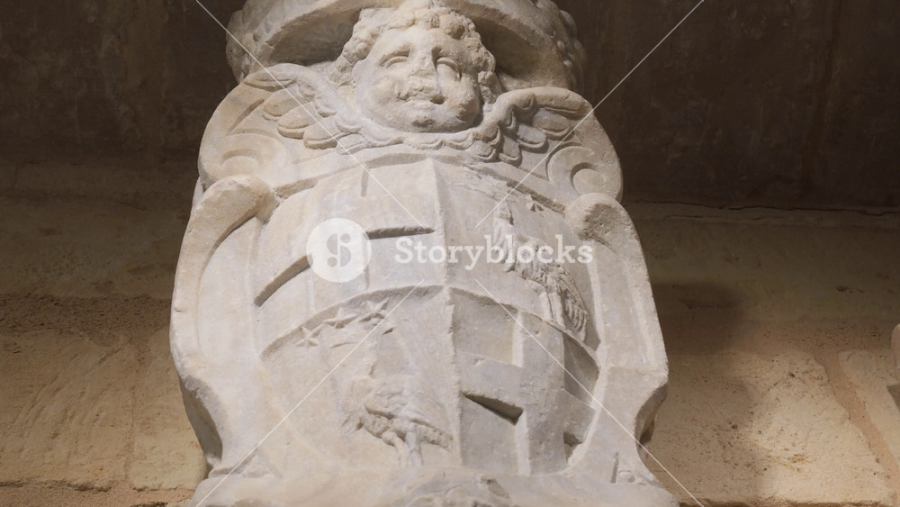 carved stone coat of arms fort st elmo cherub head crest heraldic shield eagle motif museum interior lighting valletta malta knights of malta military heritage order of st john military heritage