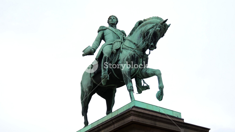 ground level oslo norway bronze equestrian statue king charles xiv john military attire rearing horse stand against overcast sky up close view sculpture royal monument