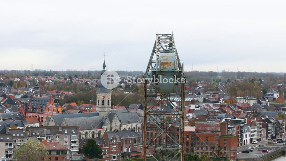 boelwerf crane historic landmark old shipyards temse city village neighborhood up close circling aerial drone shot river scheldt
