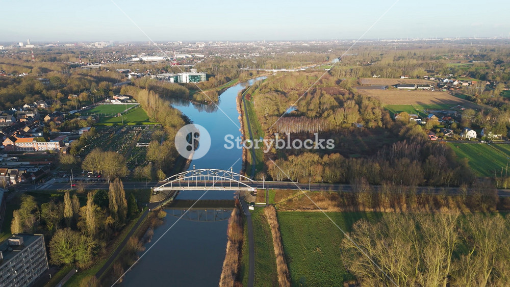 bridge melle countryside rural football pitch city ghent background sunshine enhances visual appeal river scheldt backward shot view of scenic