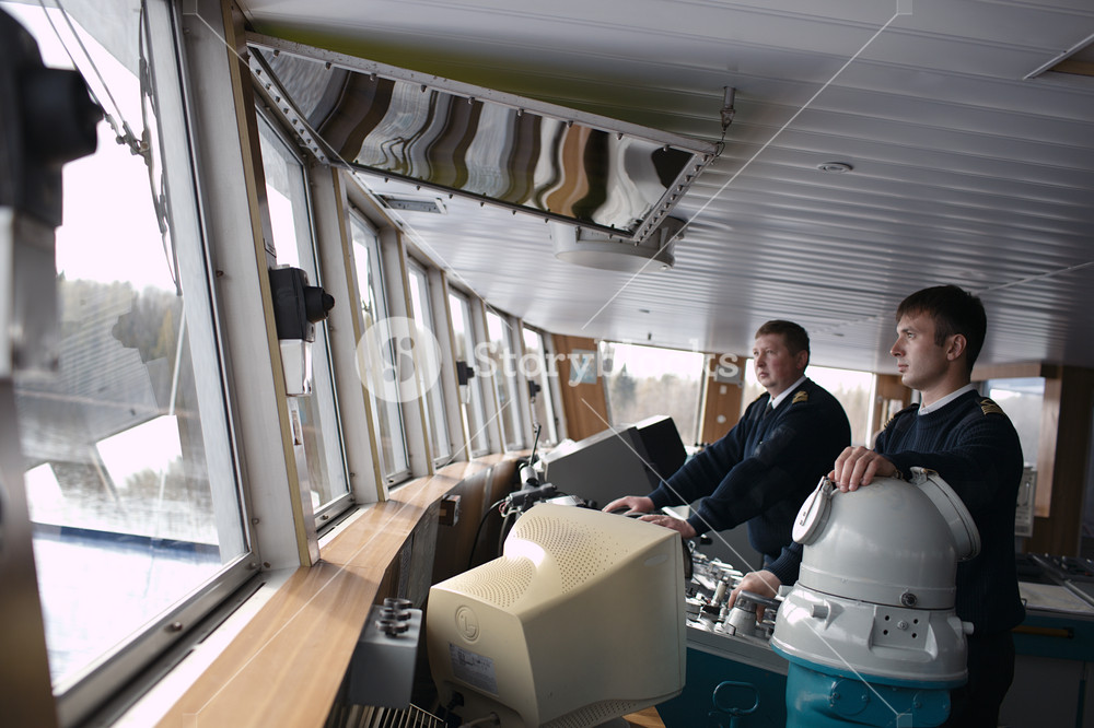 Captain driving the ship on the river Royalty-Free Stock Photo SBI ...