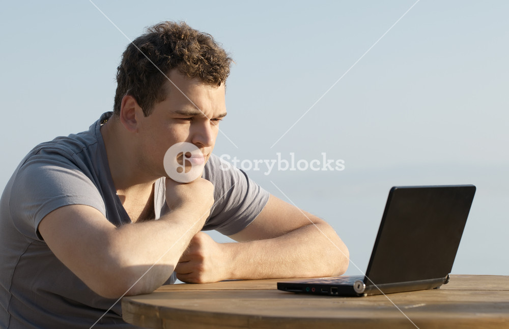 Person observing laptop display Royalty-Free Stock Image - Storyblocks