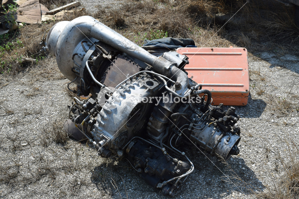 The helicopter engine which is pulled out outside. spare parts and ...